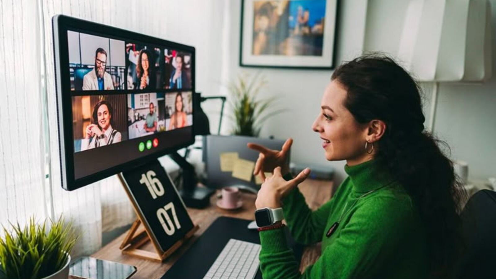 Remote employee joining a video call with her distributed team from a home office